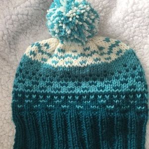 Hand knit hat with pompom